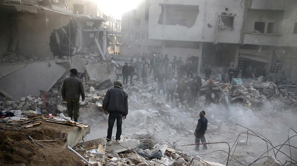 Damaged buildings after an airstrike in the besieged town of Hamoria, Eastern Ghouta, in Damascus, Syria [Bassam Khabieh/Reuters]