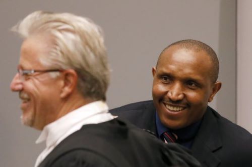 Bosco Ntaganda and his lawyer Stephane Bourgon at the ICC in 2018 [AP]