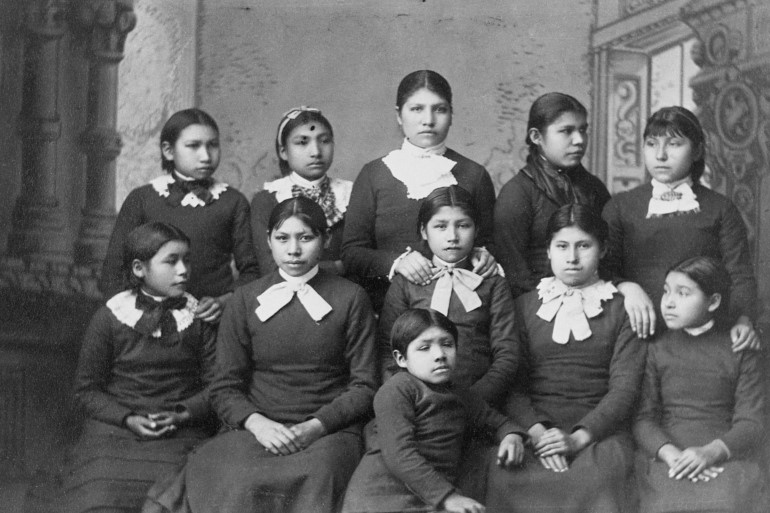 Native American girls from the Omaha tribe at Carlisle School, Pennsylvania - tens of thousands of children were taken from their parents to be 're-educated [File: Corbis via Getty Images]