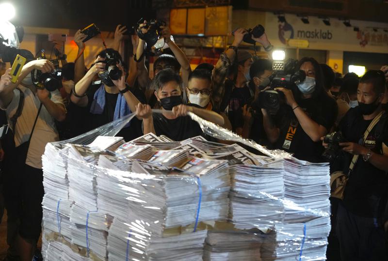 Apple Daily arrives at a newspaper booth in Hong Kong on 24 June 2021 [AP]