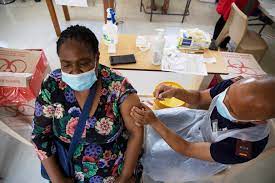 A healthcare worker receives a Johnson& Johnson vaccine in South Africa [AFP]