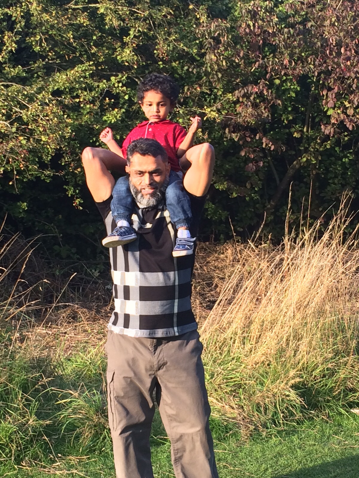 Moazzam Begg with one of his sons, 2015  [Courtesy of Moazzam Begg]