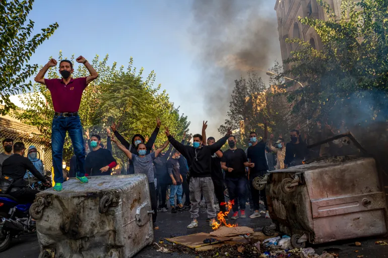 Iranians protests the death of 22-year-old Mahsa Amini after she was detained by the morality police last month, in Tehran /AP Photo/Aljazeera.