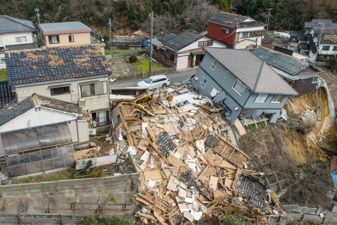 This aerial photo shows damaged and destroyed homes along a street in Wajima, Ishikawa prefecture, a day after a huge earthquake struck the prefecture's Noto region. [Fred Mery/ AFP]