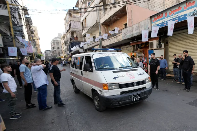 An ambulance drives in a southern suburb of Beirut on September 18, 2024, after multiple explosions were heard during the funeral of four Hezbollah fighters who were killed a day earlier when their handheld pagers exploded [Bilal Hussein/AP]