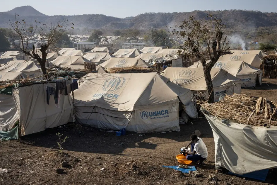 A Sudanese refugee washes his clothes at Kumer refugee camp, near Maganan, in Ethiopia's Amhara region, on March 1, 2024.  © 2024 MICHELE SPATARI/AFP via Getty Images