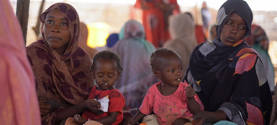 © UNICEF/Mohammed Jamal Two malnourished children receive food supplements at a health centre in Tawila, North Darfur, Sudan.