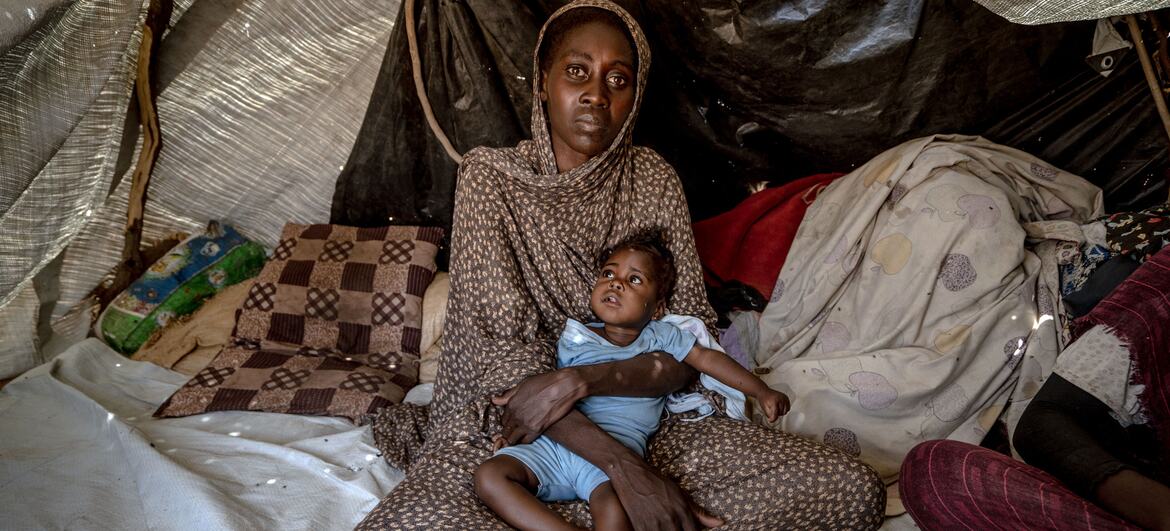 A Sudanese woman with her child.