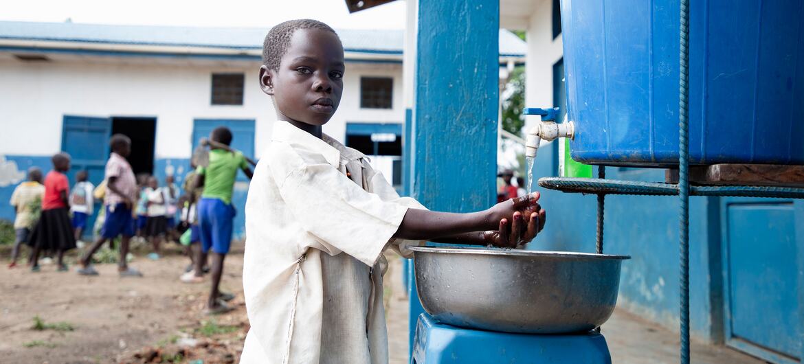 © UNICEF/Carmel Ndomba A child washes her hands at a school in Ituri Province in the DR Congo.