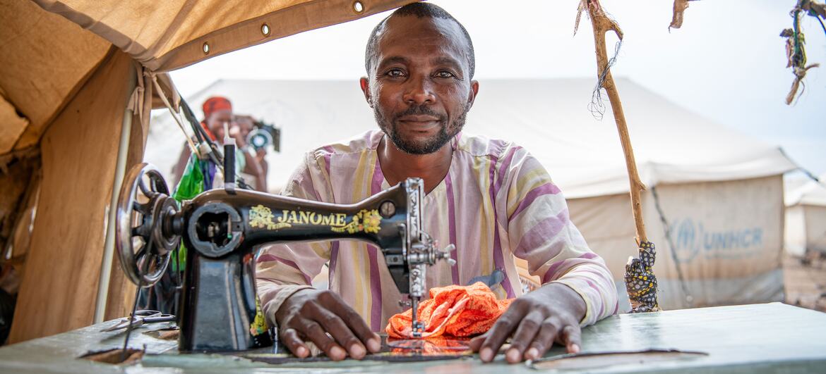 © UNHCR/Eric Bakuli A tailor from the Democratic Republic of the Congo, earns a small income through sewing to support his family at the Kakuma refugee camp in Kenya