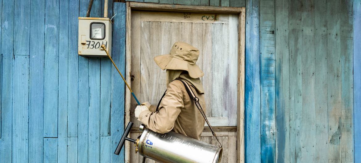 © UNDP Bolivia/Miguel Samper A health worker fumigates a house in Guayaramerín, Bolivia, to protect against mosquito-borne diseases.