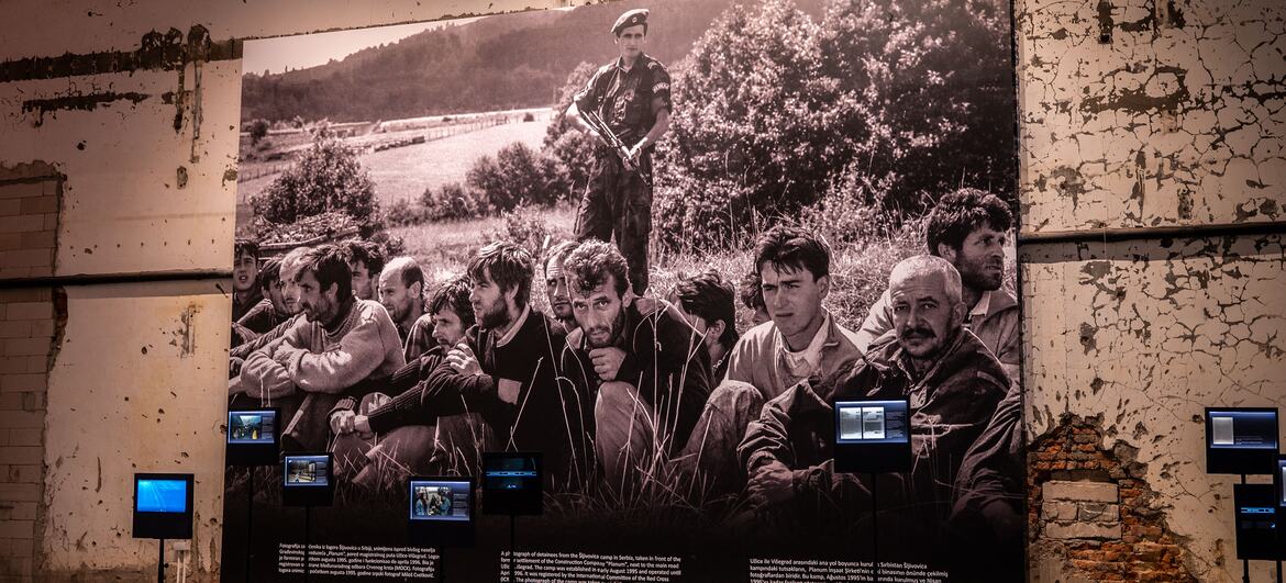 United Nations/Darko Zecevic A display at the Srebrenica Memorial Center shows cowering Bosniak Muslim men in 1995.